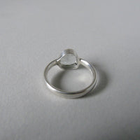 silver ring with pear white topaz