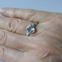 silver ring with pear white topaz
