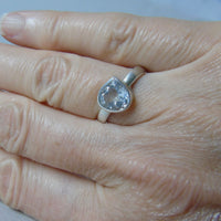 silver ring with pear white topaz