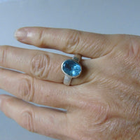 silver ring with oval salt and pepper aquamarine