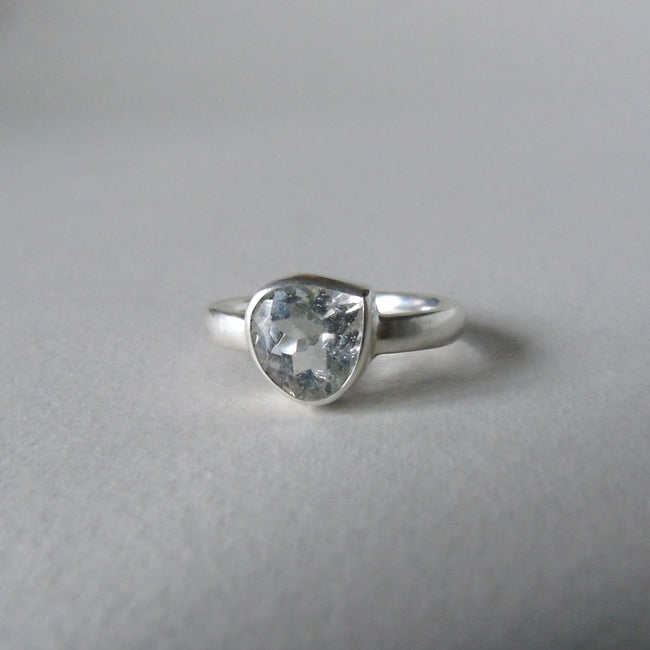 silver ring with pear white topaz