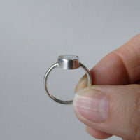 silver ring with pear white topaz
