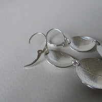 silver two larger oval leaf dish earrings