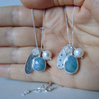 silver snowflake and frost necklaces