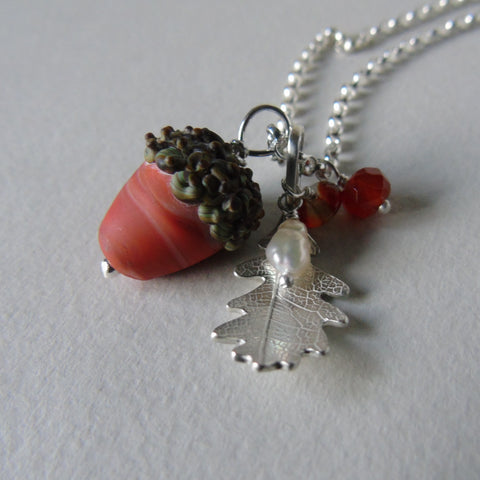 small  silver oak leaf and red glass acorn necklace