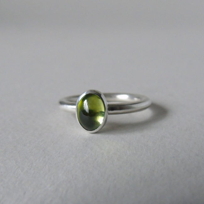 silver ring with oval peridot