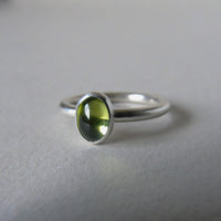 silver ring with oval peridot