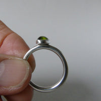 silver ring with oval peridot