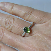 silver ring with oval peridot