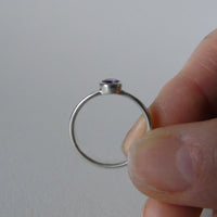 silver ring with faceted amethyst or blue zircon