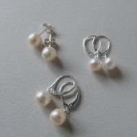 silver earrings with cream bouton pearls