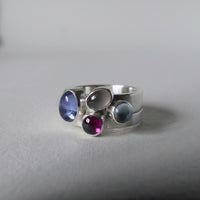 Pale iolite pair of silver cluster rings