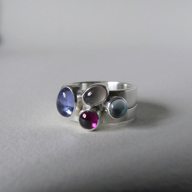 Pale iolite pair of silver cluster rings