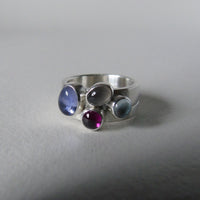 Pale iolite pair of silver cluster rings