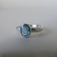 silver ring with oval cloudy blue aquamarine