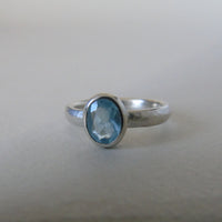 silver ring with oval cloudy blue aquamarine