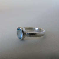 silver ring with oval cloudy blue aquamarine