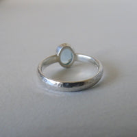 silver ring with oval cloudy blue aquamarine