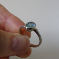 silver ring with oval cloudy blue aquamarine
