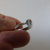 silver ring with oval cloudy blue aquamarine