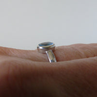 silver ring with oval cloudy blue aquamarine