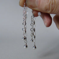Long drop silver bead earrings