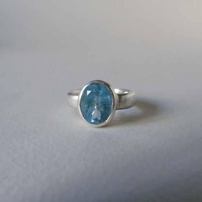 silver ring with oval salt and pepper aquamarine