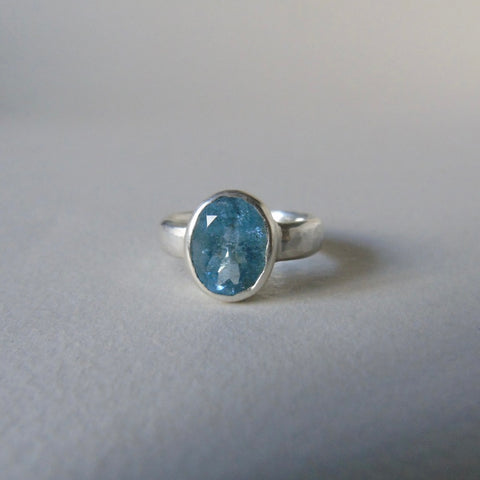 silver ring with oval salt and pepper aquamarine