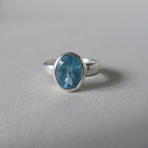 silver ring with oval salt and pepper aquamarine