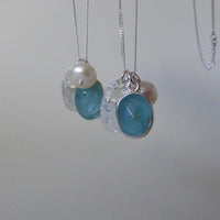 silver snowflake and frost necklaces