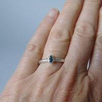 silver ring with pear blue zircon