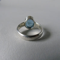 silver ring with oval salt and pepper aquamarine