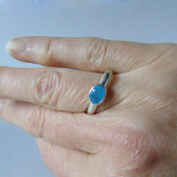 silver ring with faceted blue chalcedony