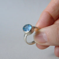 silver ring with oval salt and pepper aquamarine