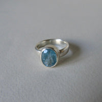 silver ring with oval salt and pepper aquamarine
