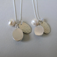 silver snowflake and frost necklaces