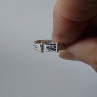 silver 'christening bangle' ring with gold detail