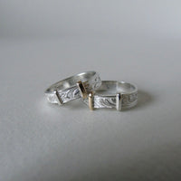 silver 'christening bangle' ring with gold detail
