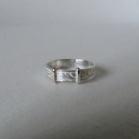 silver 'christening bangle' ring with gold detail