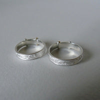 silver 'christening bangle' ring with gold detail