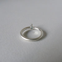 silver ring with pear blue zircon