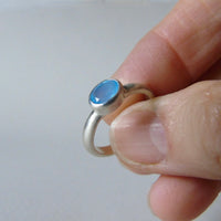 silver ring with faceted blue chalcedony