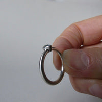 silver ring with pear blue zircon