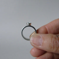 silver ring with faceted peridot or blue topaz