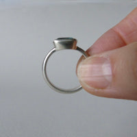 silver ring with cushion salt and pepper aquamarine