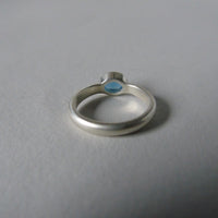 silver ring with faceted blue chalcedony