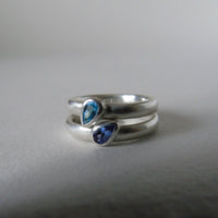 silver ring with pear shaped topaz or tanzanite