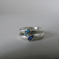 silver ring with pear shaped topaz or tanzanite
