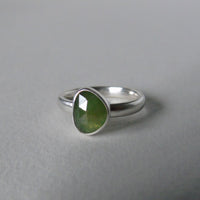 silver ring with freeform green sapphire