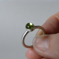 silver ring with oval peridot